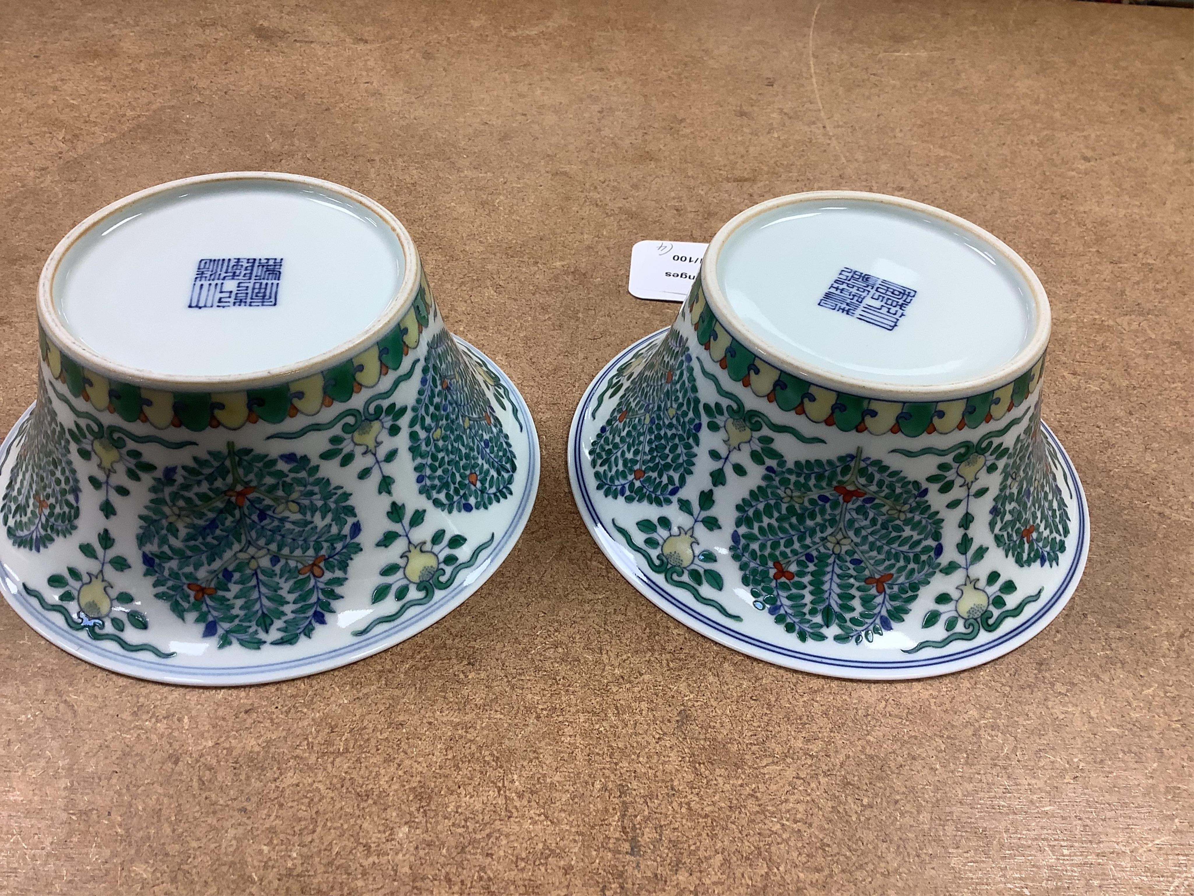 A Chinese blue and white bowl, Kangxi, 15cm. diam., a famille rose teapot stand, Yongzheng, and two doucai bowls. Condition - varies
